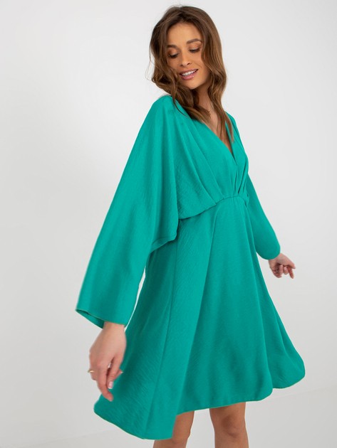 Zayna's turquoise summer dress with wide sleeves
